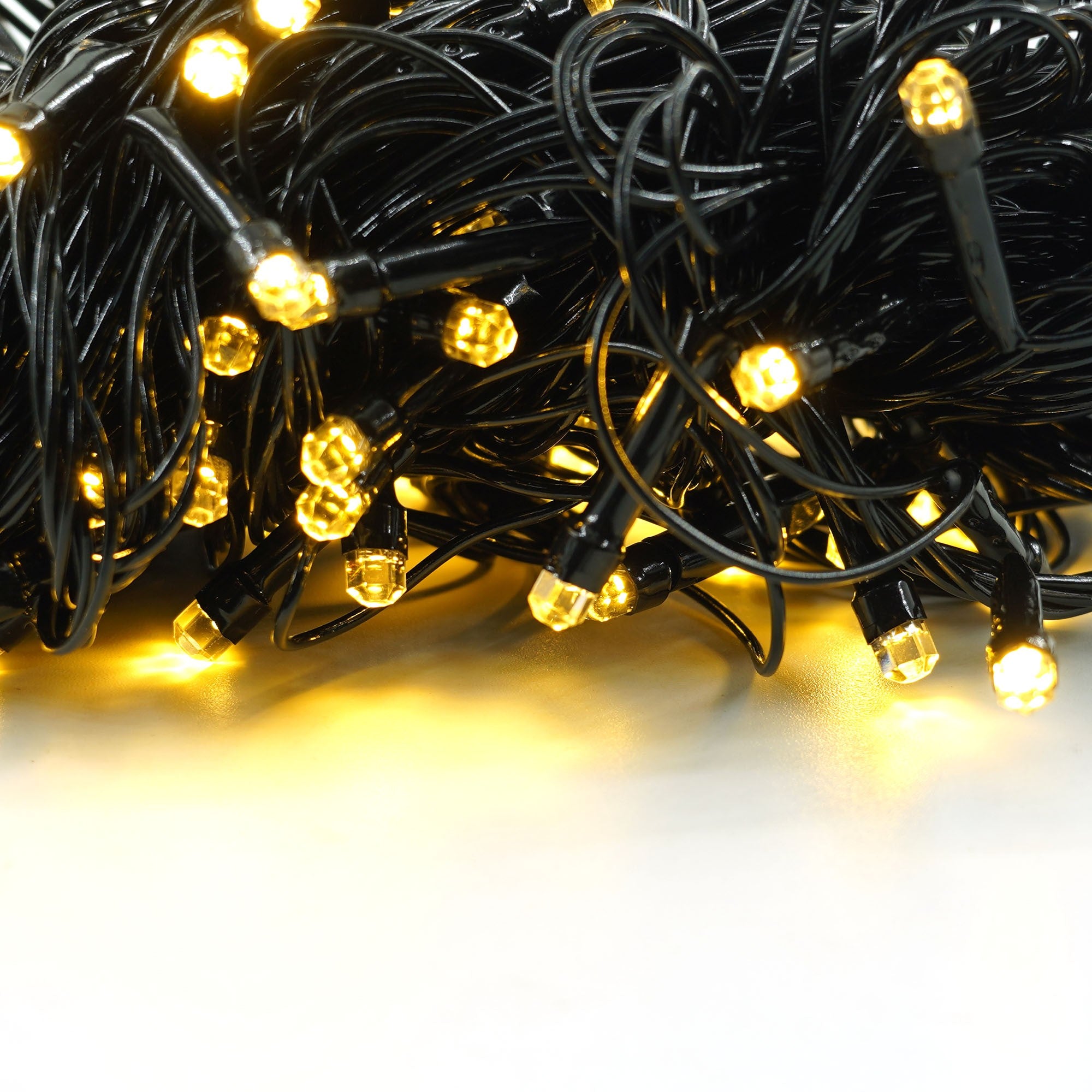Instalatie de Craciun liniara Yoto, 10 m, din care 1 m cablu priza 220V, 100 LED, 8 jocuri de lumini, beculet in 6 colturi, pentru interior, controler, fir negru, alb cald-7