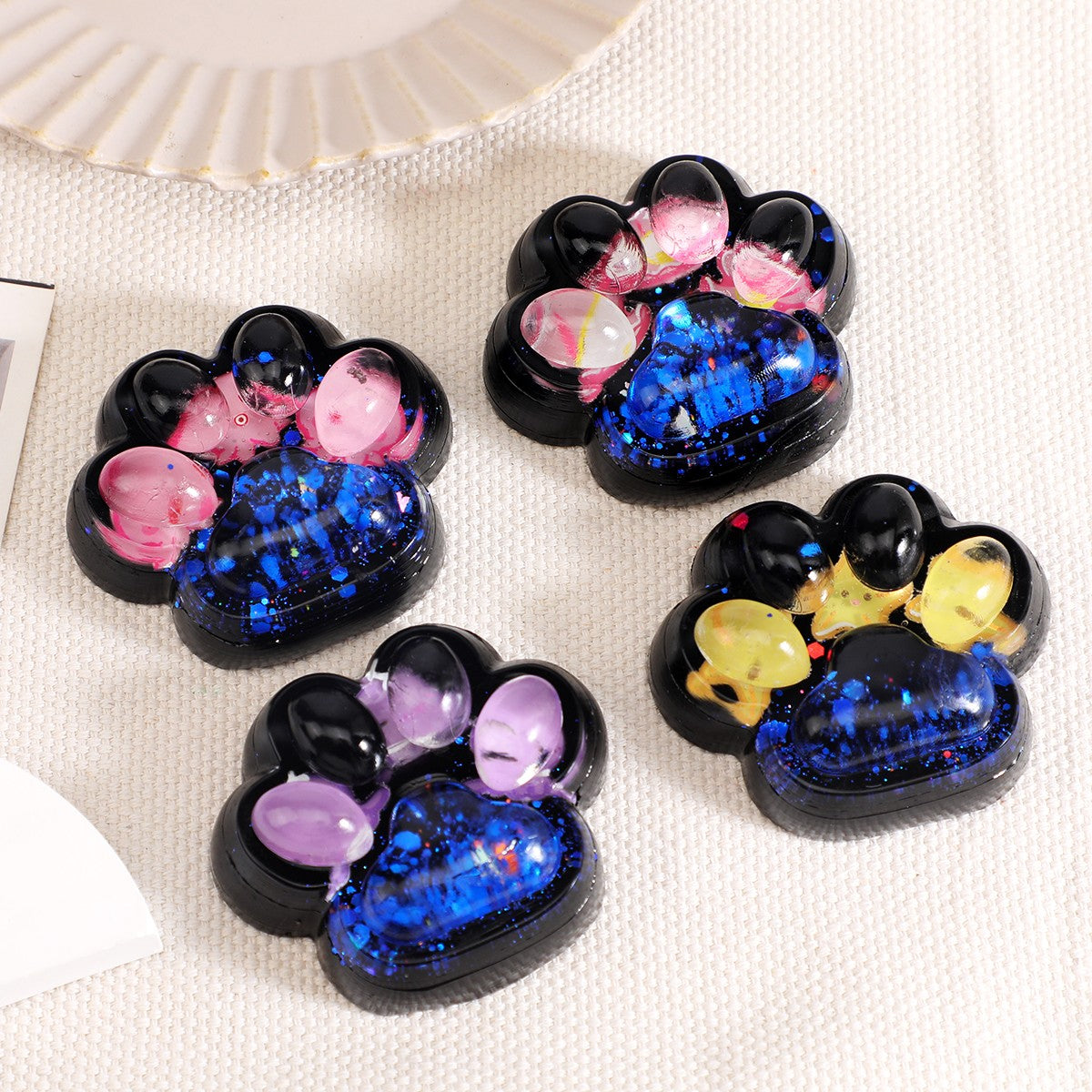 Jucarie Antistres Squishy, Flippy, cu Revenire Lenta, Model Cat Paw, 6.5x6.1 cm, 62g, Ambalaj Transparent, 4 Modele, Negru-Albastru-0
