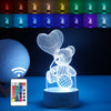 Lampa LED decorativa, Flippy, 3D, Ursulet cu balon inima, cu telecomanda, doua moduri de alimentare USB si baterii, 20 cm inaltime, din material acril si lumina multicolora, alb-0