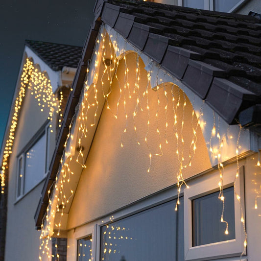 Instalatie Craciun Yoto, Tip Franjuri/Turturi, 12 m, 300 LED-uri, Prelungitor 1.5 m, 8 Jocuri de Lumini, Interconectabila, Conectare la Retea, Fir transparent, Interior/Exterior, Alb Cald-0