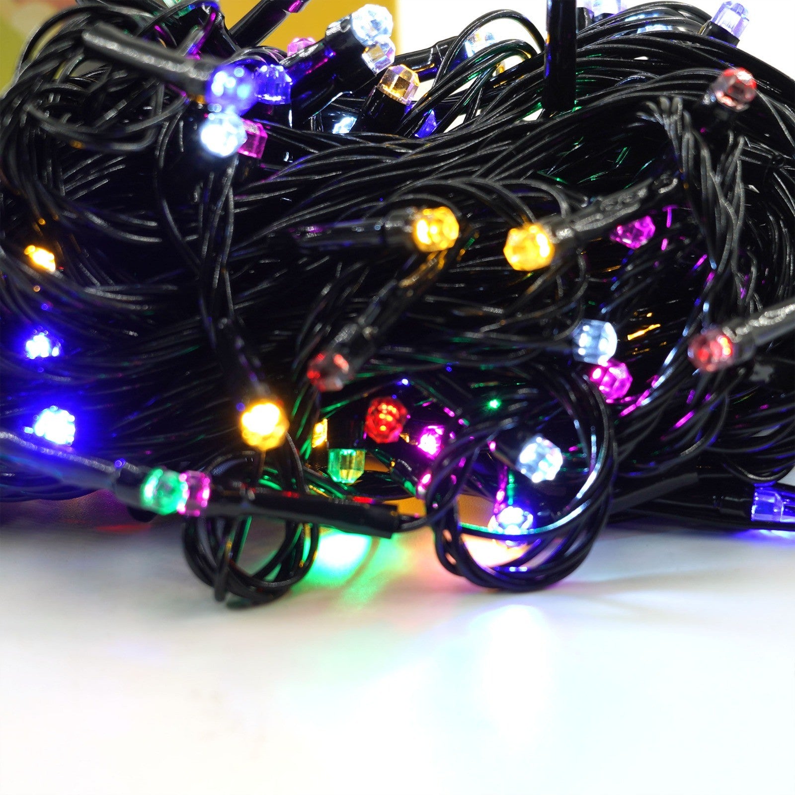 Instalatie de Craciun liniara Yoto, 10 m, din care 1 m cablu priza 220V, 100 LED, 8 jocuri de lumini, beculet in 6 colturi, pentru interior, controler, fir negru, multicolor-7