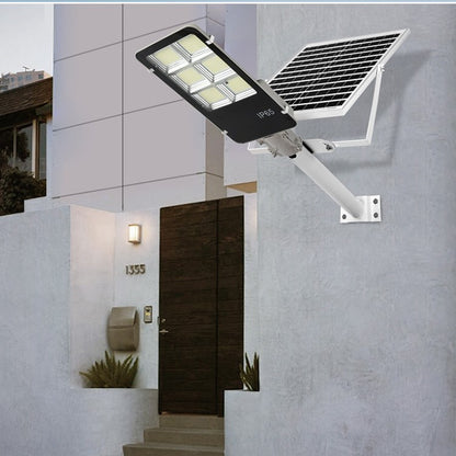 Lampa solara stradala Flippy, IP65, senzor de lumina, 100 LED-uri SMD, 7200 lm, panou 12W, putere 80W, autonomie 12-16 ore, telecomanda, montare prin fixare, pentru strada sau gradina, finisaj lucios, material ABS, 38.6 x 13.3 x 6.5 cm, lumina a-1